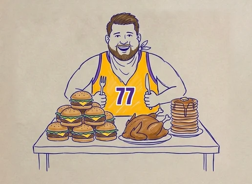 Luka Doncic in a Lakers 77 at a table piled with burgers, a roast chicken and pancakes